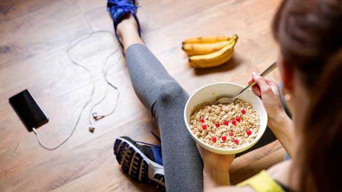 woman eating diet healthy exercise workout gear food photo getty images
