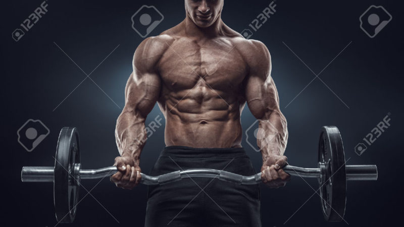 41423185-Closeup-portrait-of-a-muscular-man-workout-with-barbell-at-gym-Brutal-bodybuilder-athletic-man-with--Stock-Photo